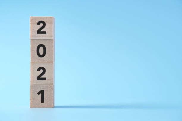 istock New Year concept with 2021 text on wooden cube block, background with copy space 1272634590