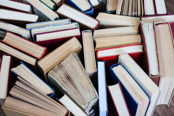 istock stack of old book, education concept background, many books piles with copy space for text 1272635458