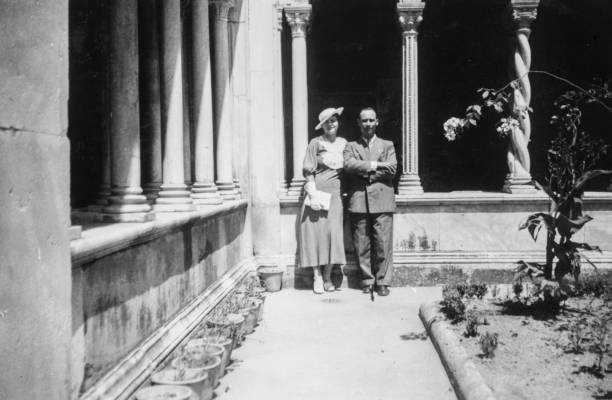 Elegant dressed couple having fun visiting Rome in the 1930s. Italy. Elegant dressed couple having fun visiting Rome for their wedding in the 1930s. Italy. rome italy photos stock pictures, royalty-free photos & images