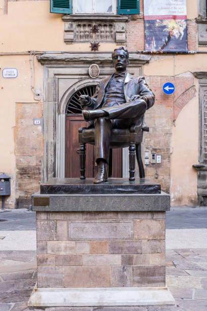 Pisa Italy Pisa, Italy - July 9, 2017: View of Giacomo Puccini Statue in Pisa Old Town giacomo puccini stock pictures, royalty-free photos & images