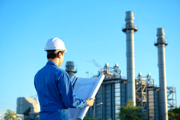istock Engineer inspecting in industrial oil refinery. Industry 4.0 concept. Background blurred concept. 1272639295