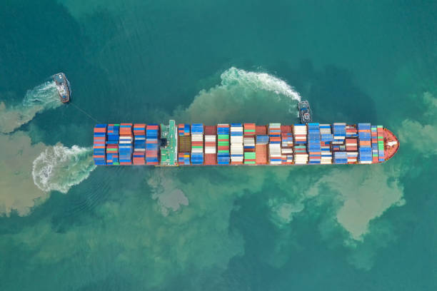 istock Container , container ship in export and import business and logistics. Shipping cargo to harbor by crane. Water transport International. Aerial view and top view. 1272639428
