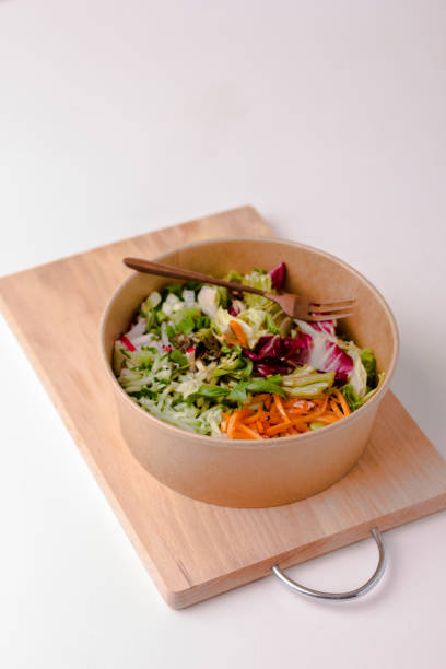 Healthy salad in kraft paper