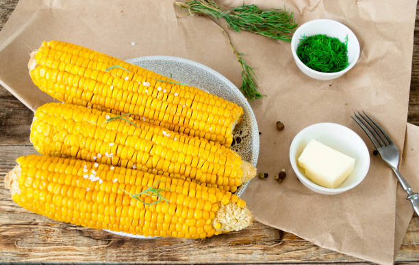 istock grilled corn, boiled corn on a wooden background. 1272642722