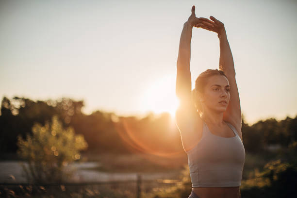 istock One young attractive sportswoman doing stretching exercise outdoors 1272642961