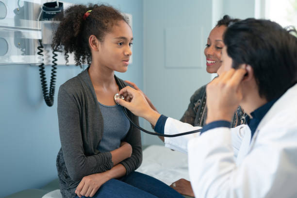 istock Adolescent girl getting check up from the doctor 1272644848
