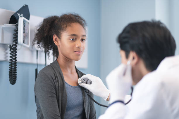 istock Adolescent girl getting check up from the doctor 1272644877