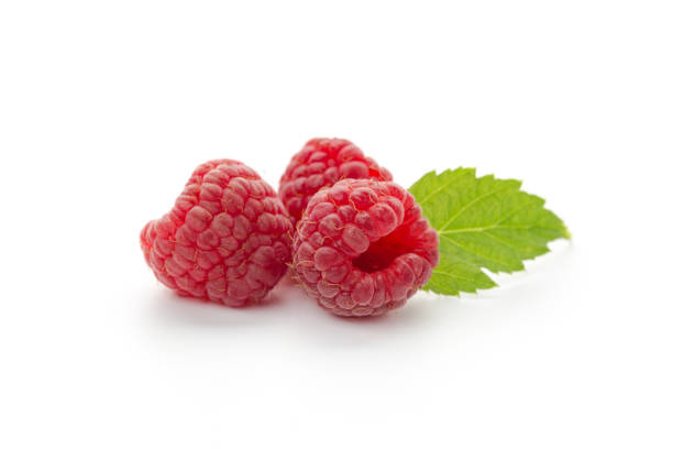 istock Ripe raspberries with leaf isolated on a white background 1272647132