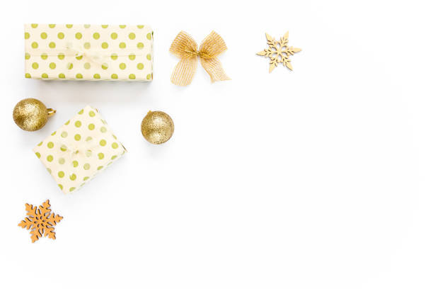 istock Christmas Texture made of gold decorations on white background with empty copy space for text. Holiday and celebration concept. Top view. Flat lay 1272649235