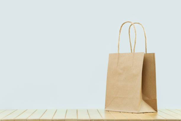 istock One plain paper bag. Packages delivery and sale 1272650358