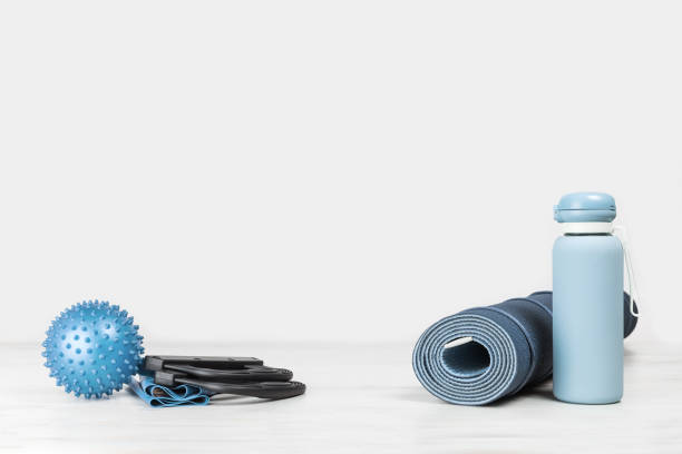istock Rolled yoga mat and exercise resistance band 1272650397