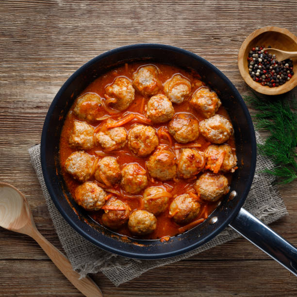 istock Meatballs in a pan in tomato sauce 1272650806