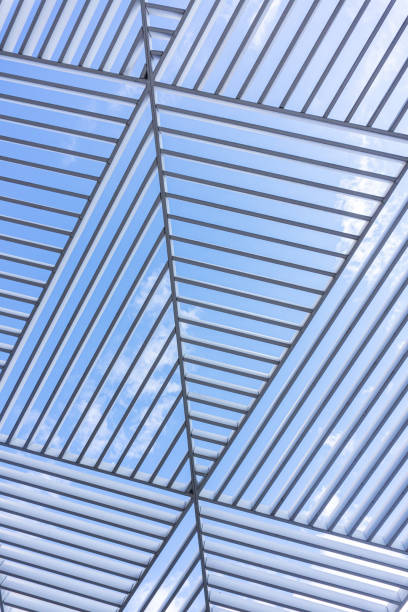 triangle pattern of a building metal lines against blue sky background
