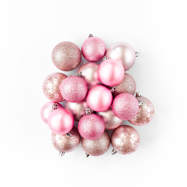 Christmas decoration: pink glass christmas balls on white background. flat lay, top view