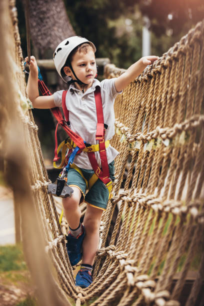 istock Brave little boy having fun at adventure park 1272654574