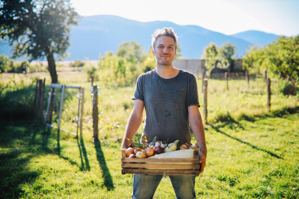 istock Man working on the small sustainable organic farm 1272663532