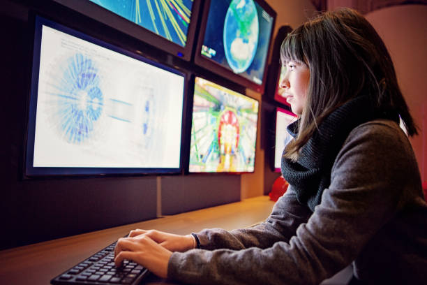 Young woman is working in a control room Young woman is working in a control room control room stock pictures, royalty-free photos & images
