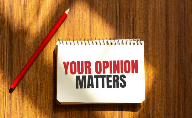 istock Red pen and notepad with text YOUR OPINION MATTERS in the white background 1272664472