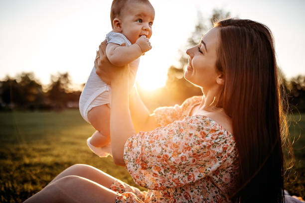 istock Mother holding baby 1272666090