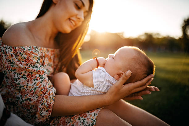 istock Mother holding baby 1272666960