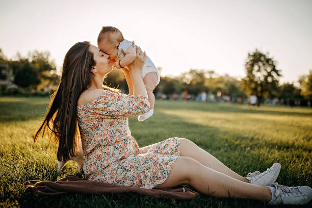 istock Mother holding baby 1272667133