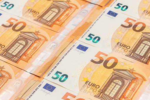 Paper banknotes of 50 Euro. Cash close-up, color background of money view from above.