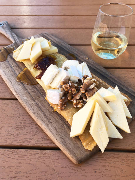 istock Cheeseboard with Cheese, Honey, Nuts and Dried Fruit 1272674431