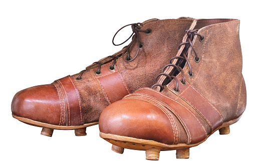 Vintage leather hanged brown football shoes soccer isolated on white