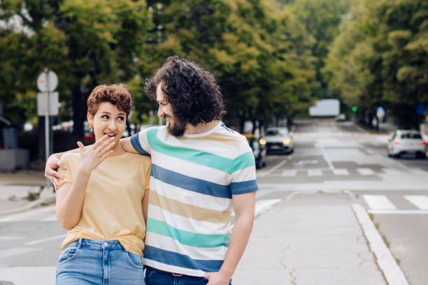 istock Happy couple walking and flirting 1272675565
