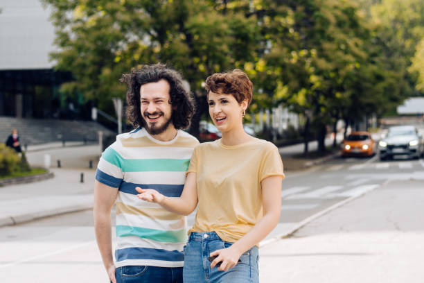 istock Young couple walking together and having fun 1272675580