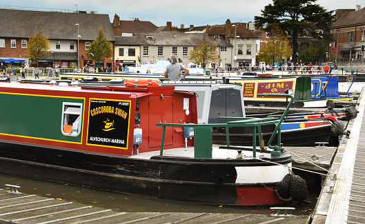 Stratford upon Avon, Warwickshire, England - October 2017: Barges moored in the town's lock basin