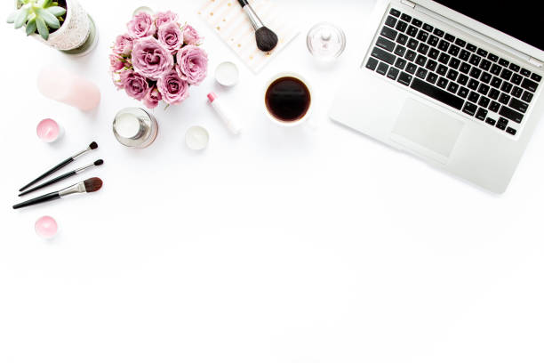 istock Makeup tools. Home office workspace. Female fashion, makeup brushes, cup of coffee on white background. Flat composition. Top view. Flat lay 1272676769