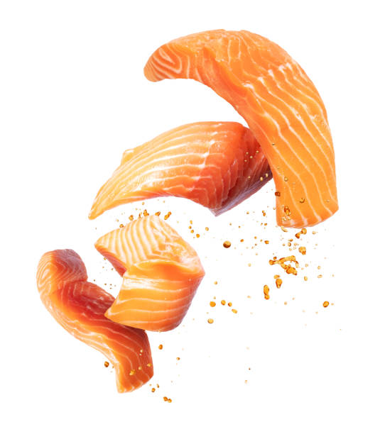 istock Sliced red fish in the air on a white background 1272679403