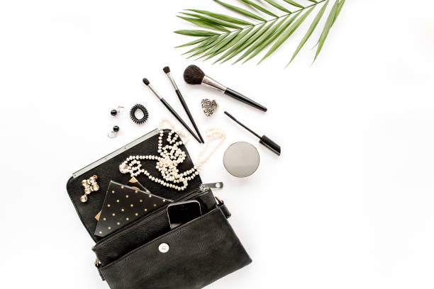 istock Makeup tools. Home office workspace. Female fashion, makeup brushes, cup of coffee on white background. Flat composition. Top view. Flat lay 1272679426