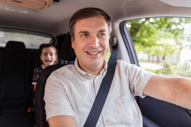 istock Father driving his daughter to school 1272681372