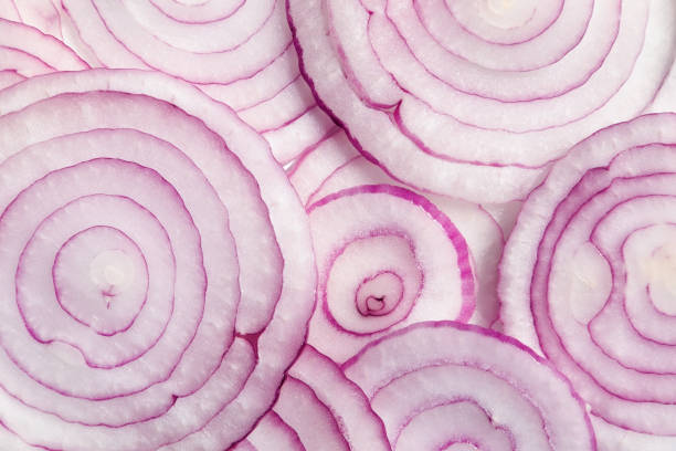 istock Round slices red onion close-up food background. 1272682519