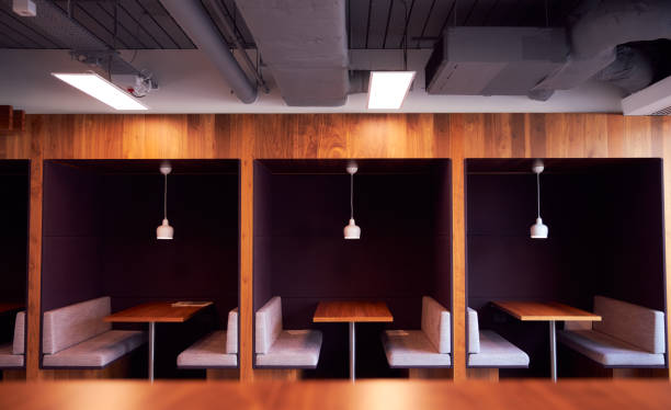 istock Empty Cubicles In Modern Office Building During Health Pandemic 1272683628