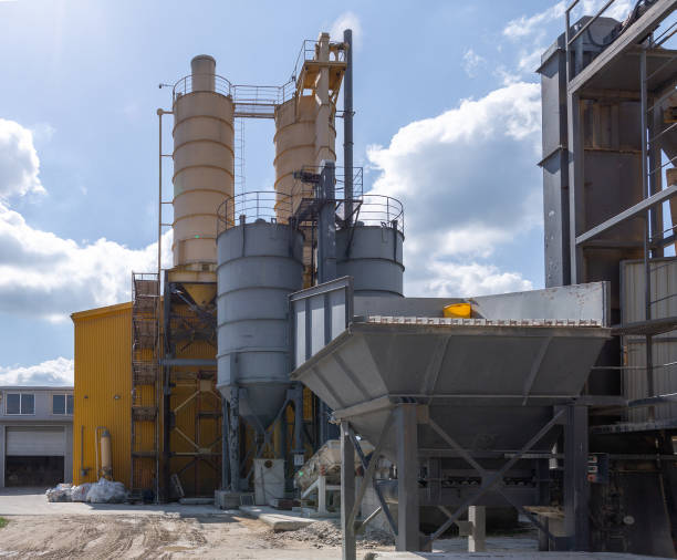istock Industrial production of construction mixtures. Tower silos with bulk ingredients. Line for drying and sorting of sand. 1272683949