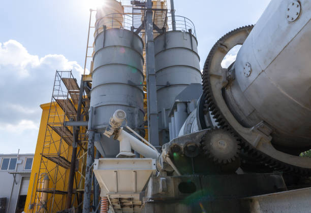istock Industrial production of construction mixtures. Tower silos with bulk ingredients. Line for drying and sorting of sand. 1272683985