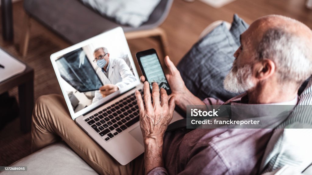 senior man teleconsulting with the doctor Healthcare And Medicine Stock Photo