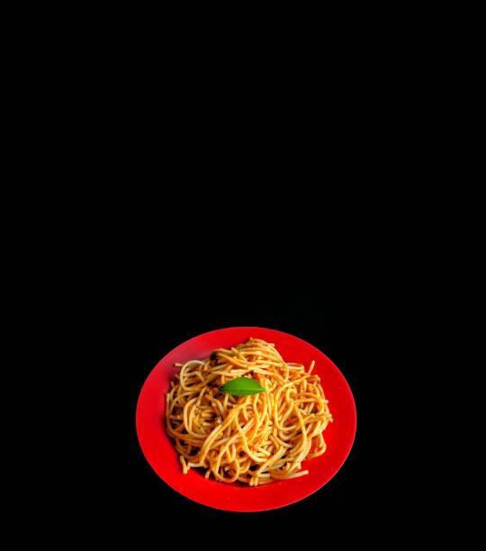Italian pasta spaghetti on black background. healthy food concept