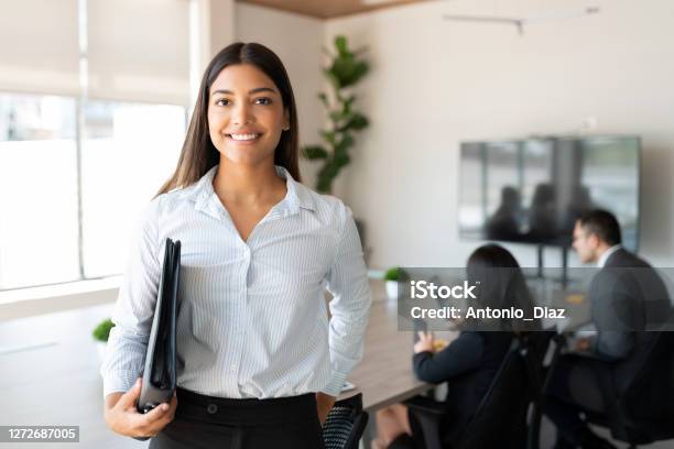 Hispanic Female Business Professional In Office Boardroom Stock Photo - Download Image Now