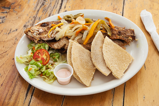 Escovitch Fried Fish paired with fried bammy slices. A must have meal when traveling the Caribbean