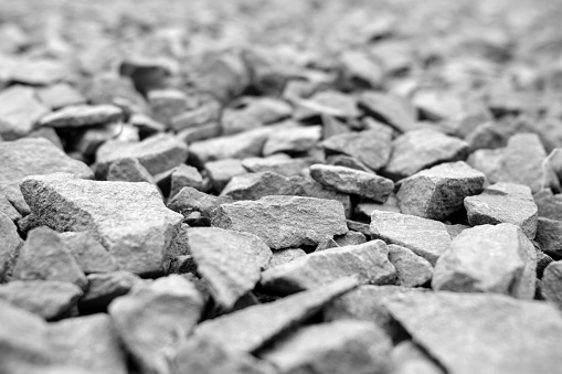 Black and white texture of stone chips gravel.