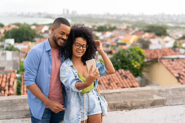 istock Couple taking a selfie in Olinda, Pernambuco 1272694374