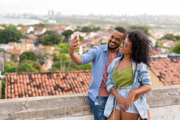 istock Couple taking a selfie in Olinda, Pernambuco 1272694431