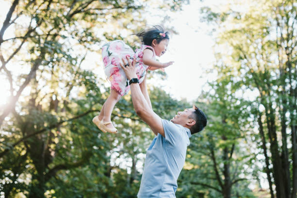 istock Loving Family Playing In Sunny Park 1272694559