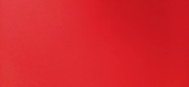 istock Red beautiful bright background. Color gradient depending on the light. To the left - dark red, to the right - the hue brightens. Scarlet uneven color. Sheet of colored paper with natural light 1272694600