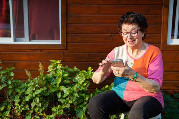 istock Happy senior woman using mobile 1272698540