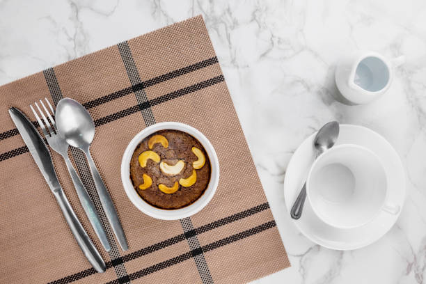 istock Brownie cake with nuts on white bowl 1272699191